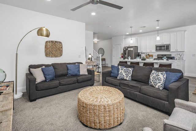 Living room with two sofas and woven ottoman