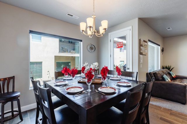 Dining table for eight set beside patio window