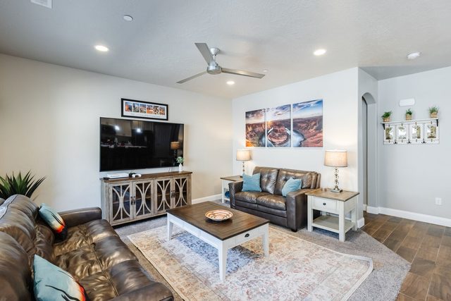 Living room with leather sofas and large TV
