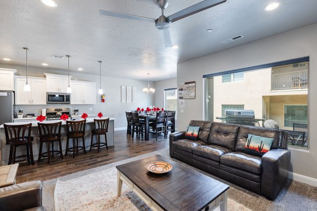 Open living room with kitchen island and dining beyond