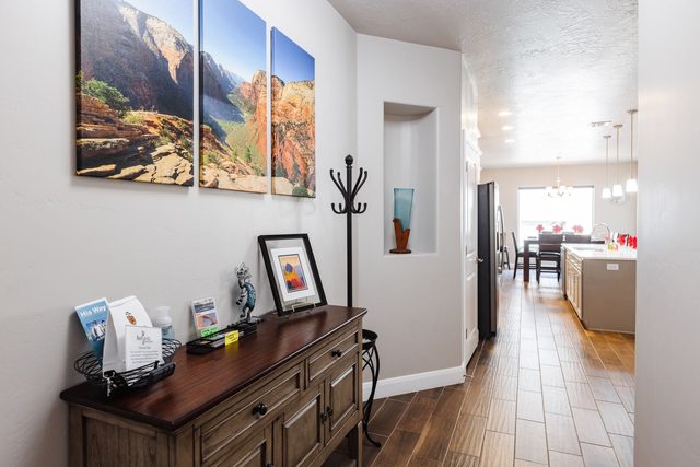 Entry hallway with console table looking toward the kitchen